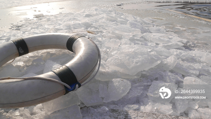 A lifebelt on the ice swimming spot at wintery beach