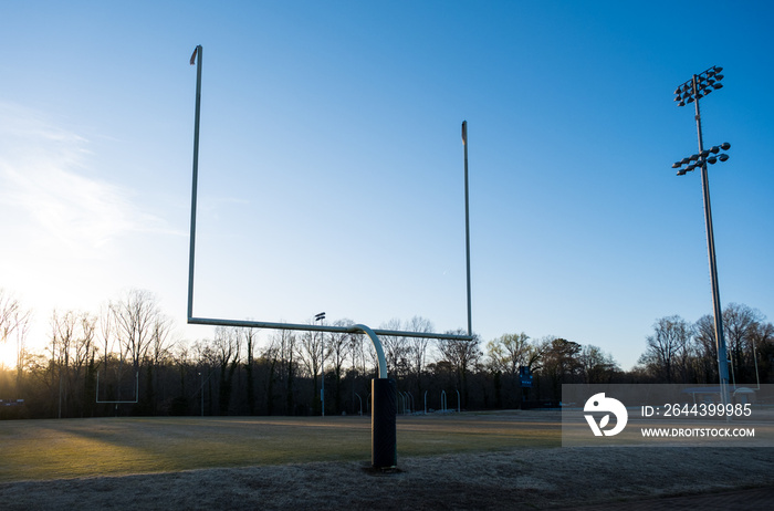 An American Football Field with Goalpost late on a Sunny Day