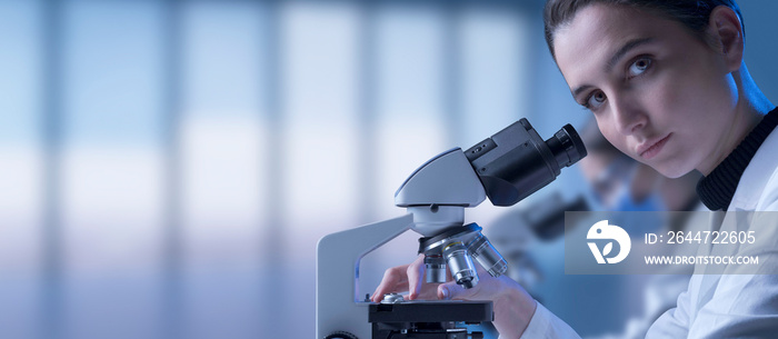 Young researcher posing and looking at camera