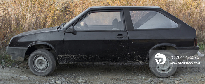 Old black car side view. Old hatchback. Retro car