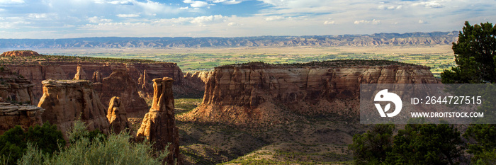 Colorado National Monument’s backlit  Independence Monument  glows late in the evening, near the towns of Fruita and Grand Junction