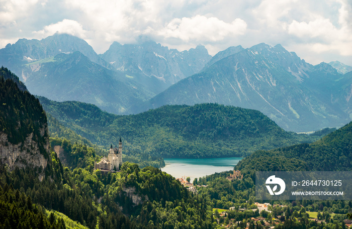 The Neuschwanstein Castle with the Bavarian Alps in the background