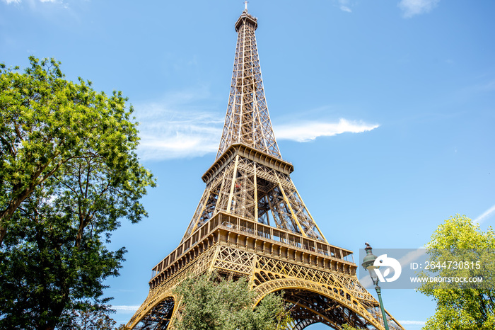 Landscape view from below on the Eiffel tower during the sunny weather in Paris