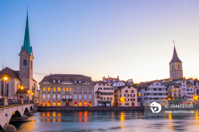 Scenic panoramic view of historic Zürich city center with famous Fraumünster and Grossmünster Church and river Limmat at Lake Zurich on a beautiful sunny day with blue sky in summer, Switzerland