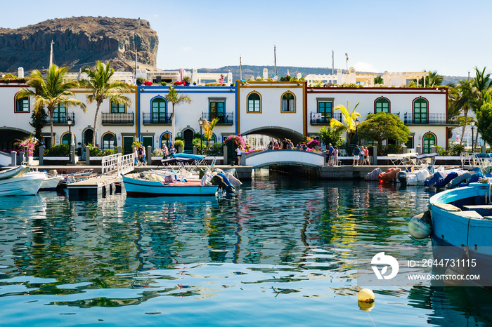 Colourful port with palm trees Puerto De Mogan on Gran Canaria island.