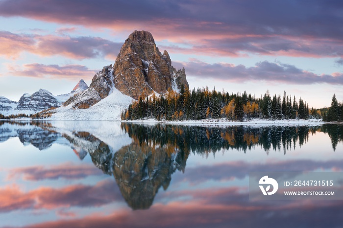 Amazing sunrise at the Sunburst peak and lake. Sunburst peak is located on the Great Divide, on the British Columbia/Alberta border in Canada. Beautiful landscape background concept