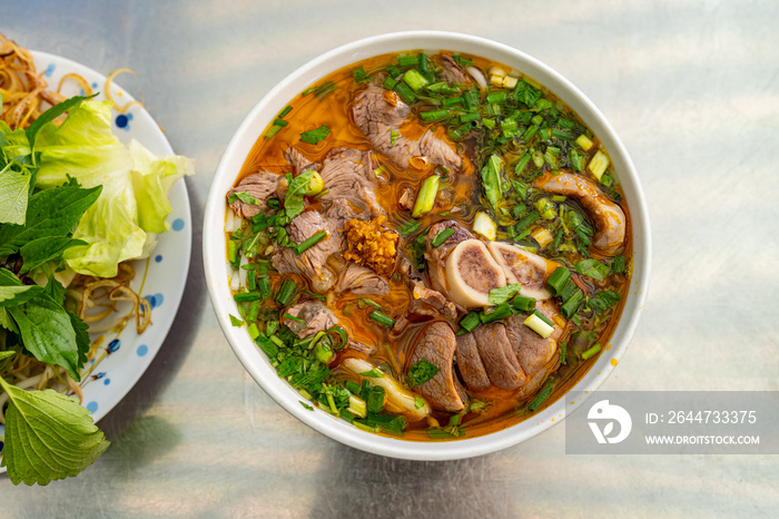 Bowl of traditional South Vietnamese noodle dish called Bun Bo Hue