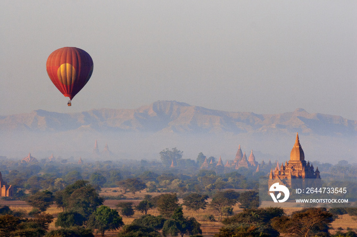 View of hot air balloon over temple