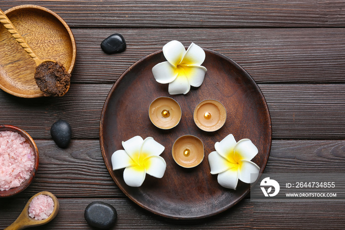 Beautiful spa composition with candles on wooden background