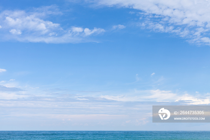 Sea water under cloudy blue sky