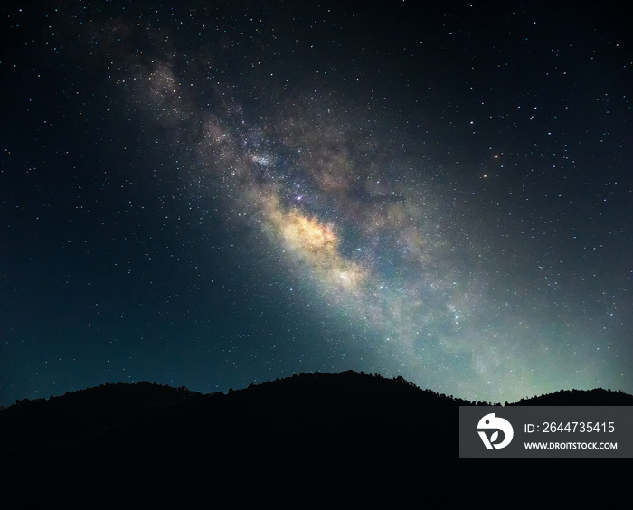 Landscape Milky Way on the night sky.Mountain at night with bright light of the stars across the sky, and dark enough to see the Milky Way galaxy