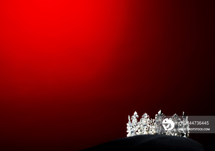 Silver Diamond Crown of Miss Pageant Beauty Universe World Contest sparkle light on black pillow, ready for wear Most beautiful Winner, studio lighting super red gradient background dramatic