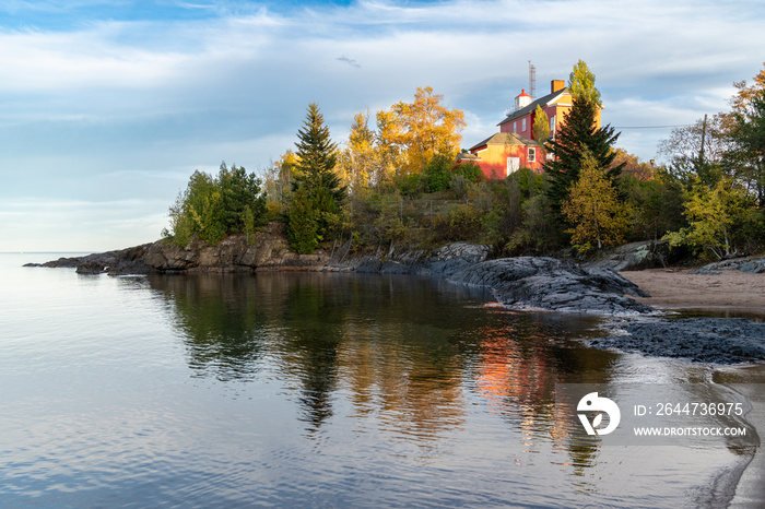 Marquette Harbor Lighthouse at sunset in the fall along Lake Superior