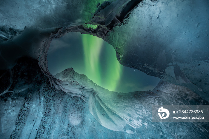 Northern lights aurora borealis over glacier ice caves in Iceland