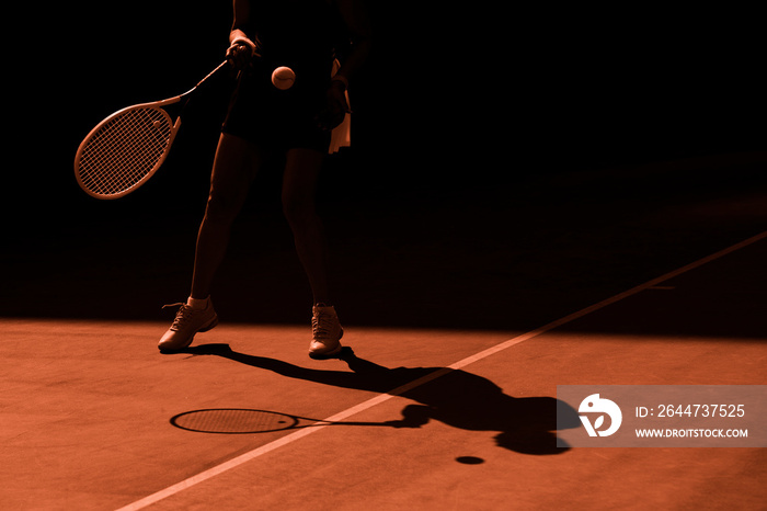 Woman tennis player in action. Orange filter