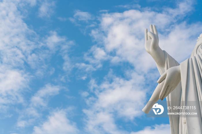 Hands of goddess Guanyin with blue sky and copy space. - Chinese goddess statue (a public temple , can take picture )