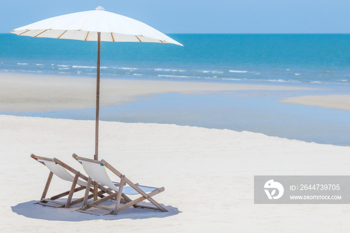 Idyllic tropical beach with white sand, turquoise ocean water and blue sky in huahin thailand