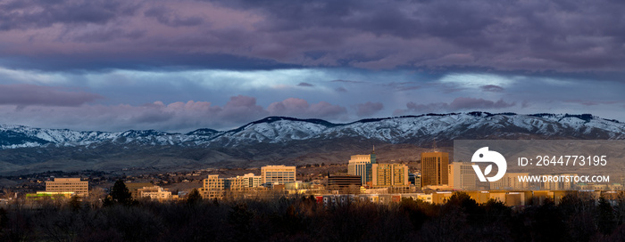 Evening sunset over the city of Boise Idaho with snow in the foothills.