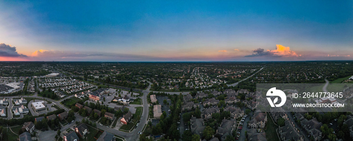 Panorama, aerial shot of reddish sunset over suburbs of Lexington, Kentucky