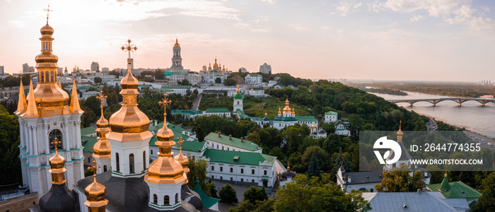 Magical aerial view of the Kiev Pechersk Lavra near the Motherland Monument. UNESCO world heritage in Kyiv, Ukraine. Kiev Monastery of the Caves at sunset.