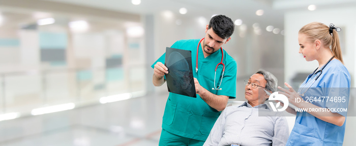 Surgeon showing xray film to senior patient looking at brain injuries with nurse standing beside the surgeon at the hospital room. Medical healthcare and surgical doctor service concept.