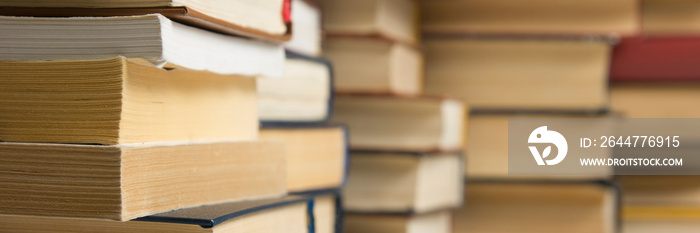 Stack of books background. many books piles.