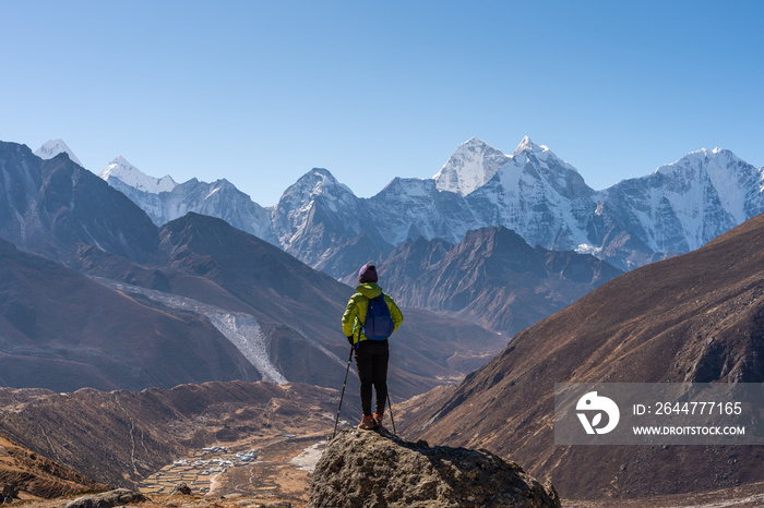 A trekker standing in front of Himalaya mountain range in Everest region, Nepal