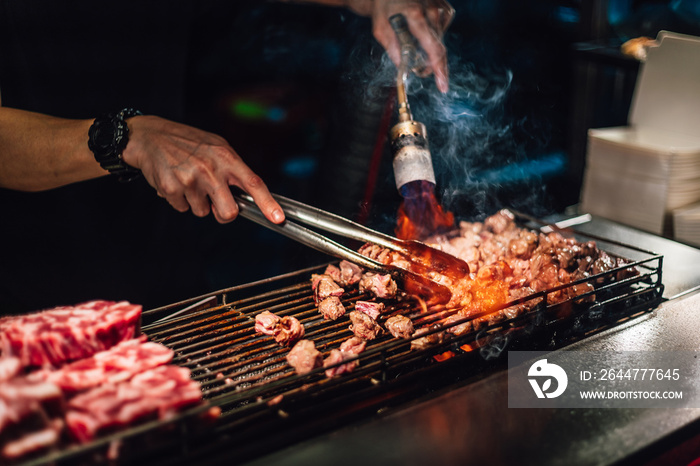 Chef cooking beef cube with blow-torched in medium rare, Juicy and tasty. Street food of Jiantan, Taipei, Taiwan.