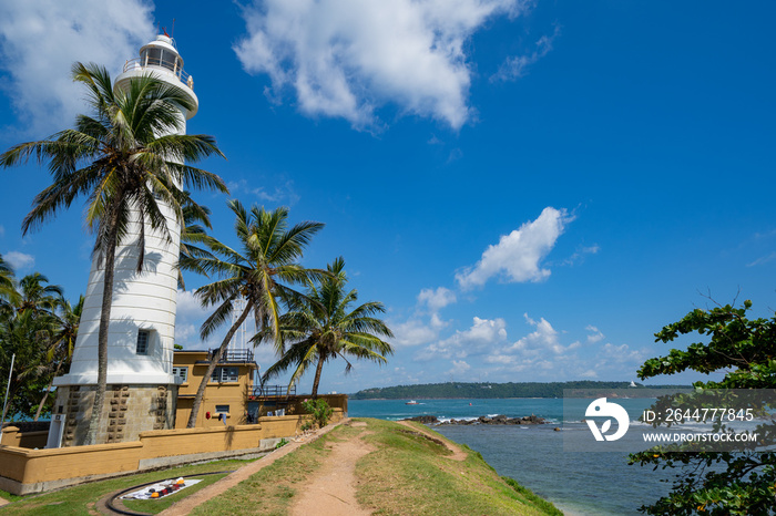 Galle Fort Lighthouse in Sri Lanka, sits next to the Indian Ocean