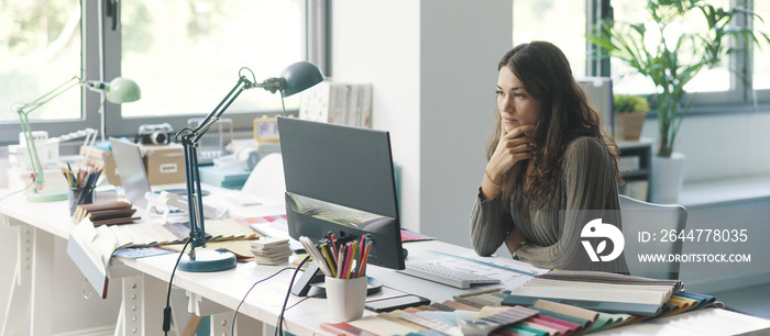 Young designer working in her studio