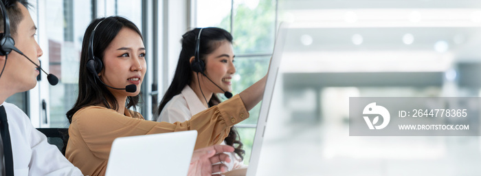 Business team wearing headset working actively in office . Call center, telemarketing, customer support agent provide service on telephone video conference call.