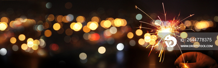 Happy New Year background with glowing sparklers.