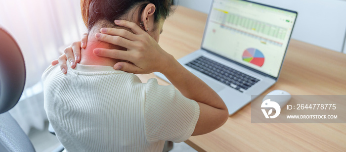 Woman having Neck and Shoulder pain during work long time on workplace. due to fibromyalgia, rheumatism, Scapular pain, office syndrome and ergonomic concept