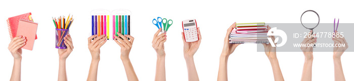 Many hands with school supplies on white background