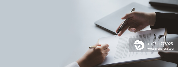 A female financier is reviewing company financial documents, monthly financial statement summary from the finance department. The concept of managing the company’s finances for accuracy and growth.