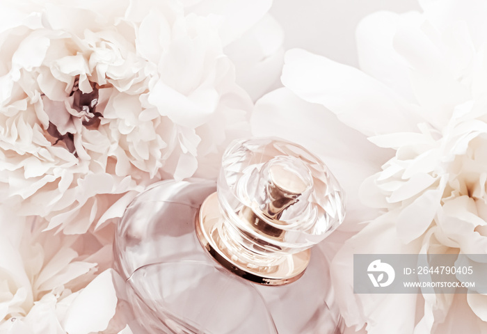 Fragrance bottle as luxury perfume product on background of peony flowers, parfum ad and beauty bran