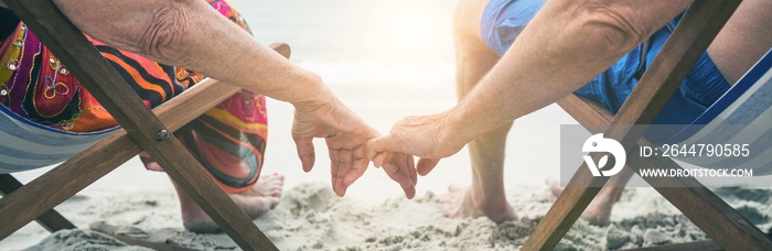 Senior couple relaxing on deckchairs