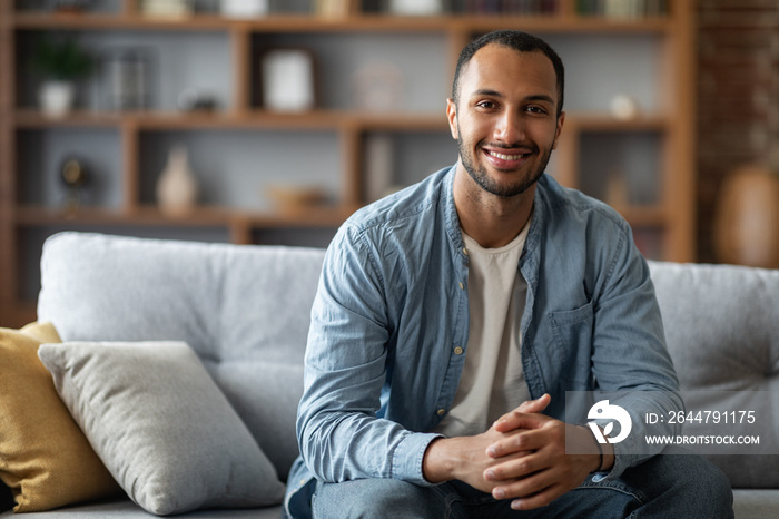 Portrait Of Handsome Young Black Man Posing In Home Interior