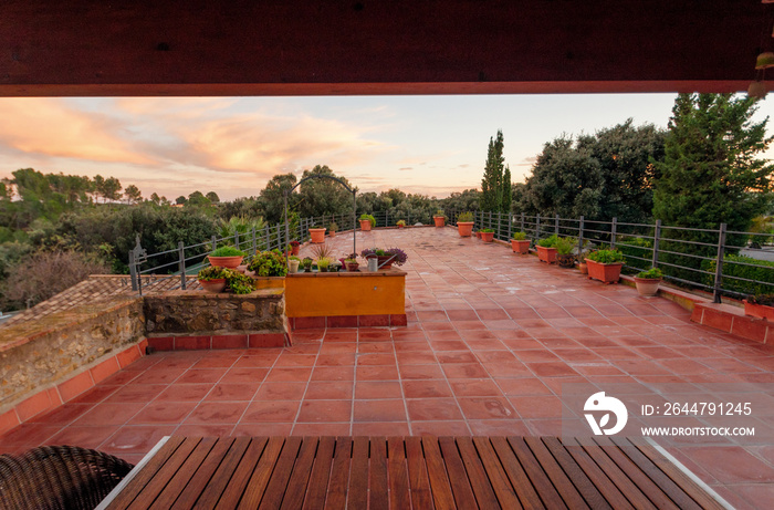 Luxury private villa terrace with red tile and  with a beautiful view of the garden.