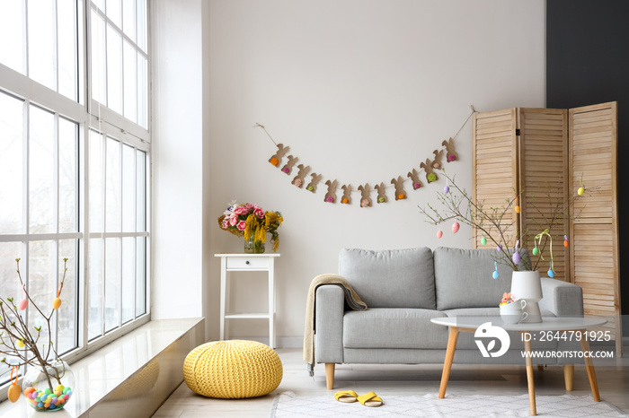 Interior of stylish living room decorated for Easter celebration