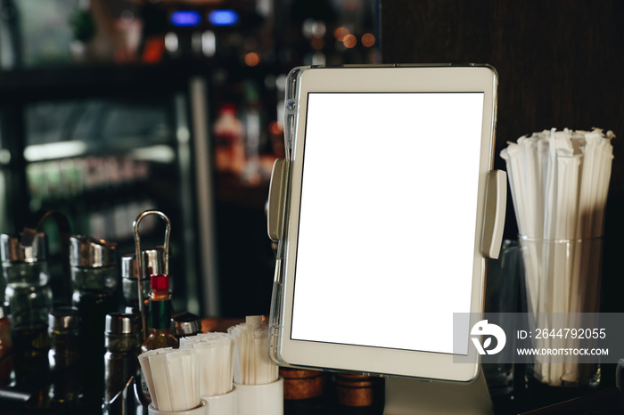 Digital tablet with white blank screen at the restaurant