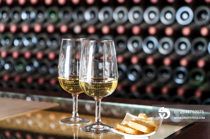 Wine tasting in the winery - 2 glasses of white wine with toasts and cheese, Lanzarote, Spain