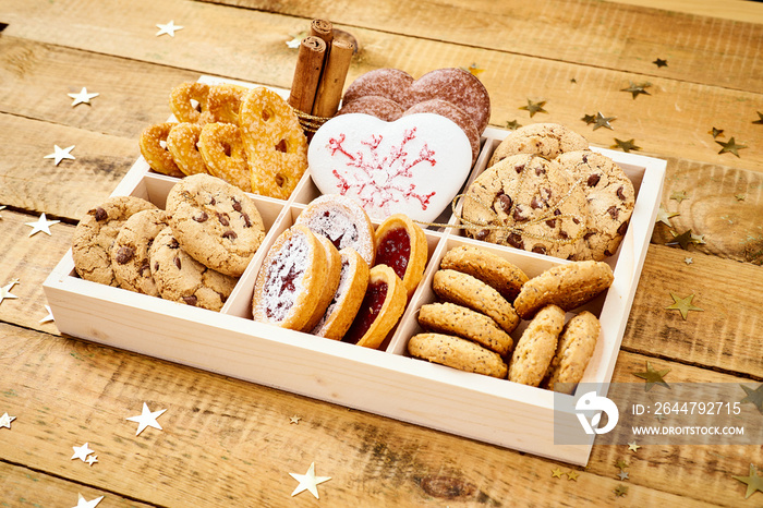 delicious Christmas Eve cookies in a box on an old wooden table