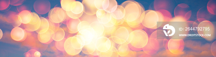 Abstract banner background image of sunset or sunrise sky with warm colors lens flare bokeh
