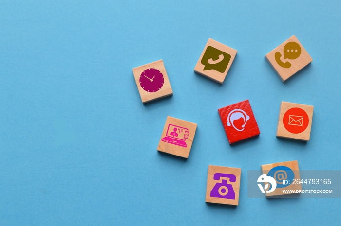 Wooden blocks with contact us and customer service icons