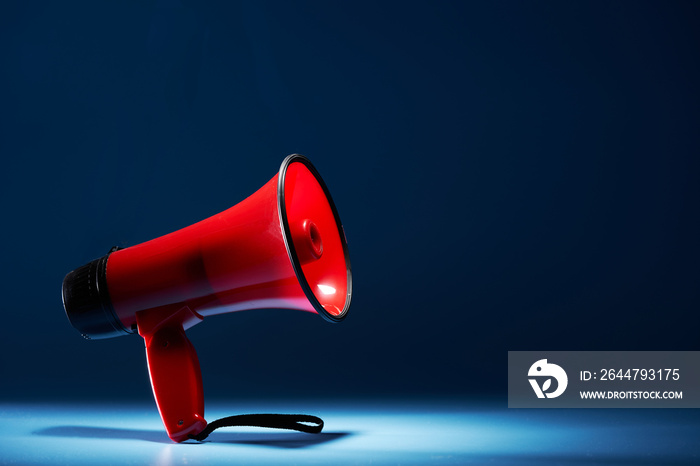 red megaphone against blue background