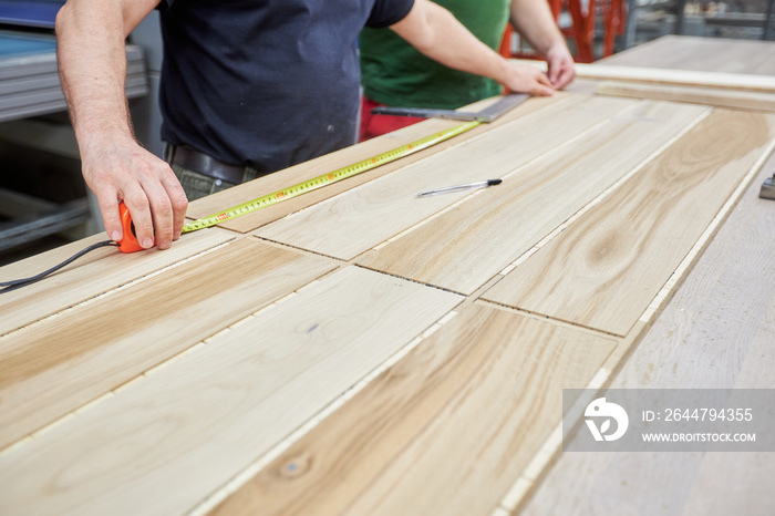 Carpenters working on wood factory with machines. Wooden furniture manufacturing process. Carpentry 