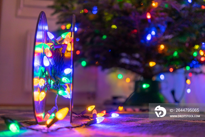 Roll of Christmas Lights with Christmas tree  in Backgroun - Bokeh Lights