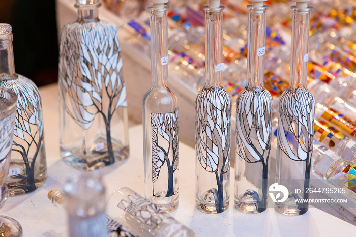 Christmas souvenirs on the counter in Europe, Painted glass Christmas balls with fairy tales.