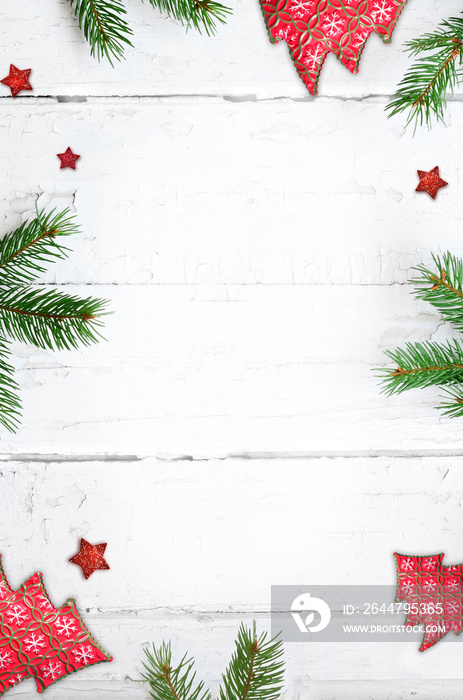 Fir branch with Christmas decorations on old wooden shabby background with copy space for text.